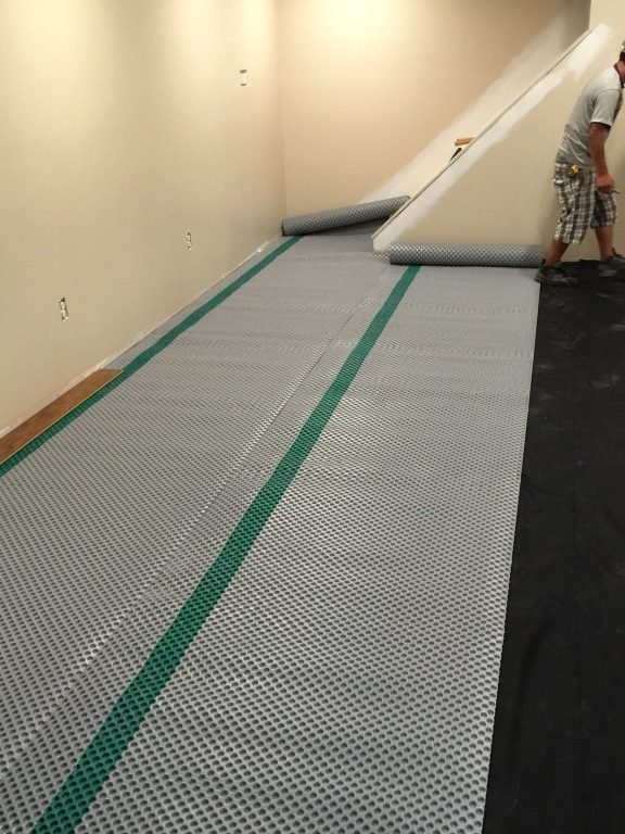 Home Improvement in Carroll County, MD 7 Basement floor in Finksburg, MD, before - Maryland Home Improvement Company